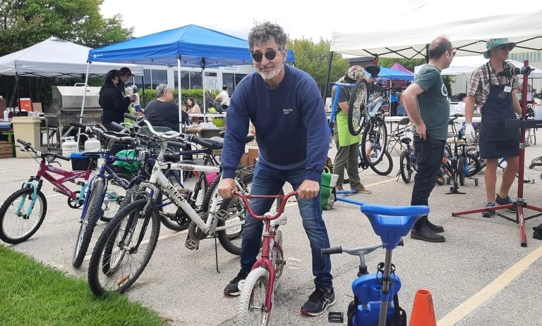 Mike Foley participating in a community bicycle repair and donation event