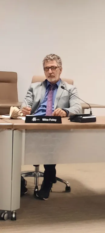 Mike Foley seated in the Upper Grand District School Board boardroom