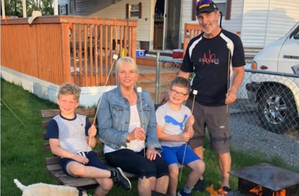Mike Foley and his family spending an evening together around a backyard fire