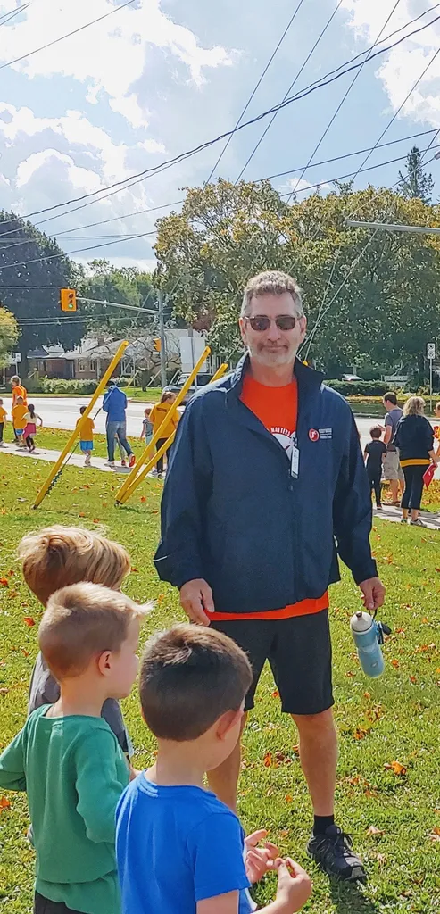 Mike Foley with children at a Terry Fox Run he organized